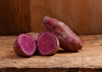 sweet potato on wooden background