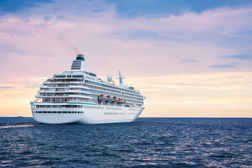 Fototapeta na wymiar Big cruise ship in the sea at sunset
