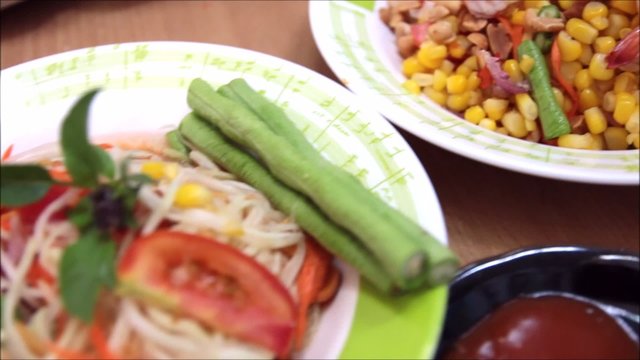 som tum, thai papaya salad and corn salad with shrimp