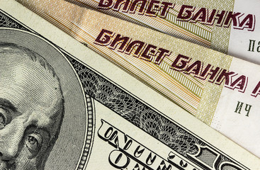 Background from dollars and rubles, close up