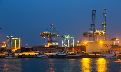 Fototapeta premium night view of cranes in seaport. Algeciras