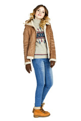 Young beautiful girl in a leather sheepskin coat and blue jeans