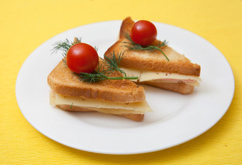 Fototapeta na wymiar triangular toast with cheese and ham