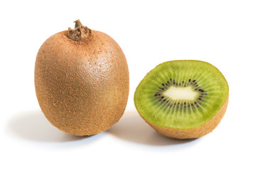 Closeup of a whole and half kiwifruits with shadow isolated