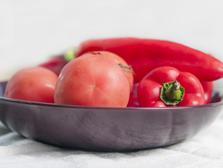 Fototapeta na wymiar Fresh sweet pepper, tomato. On a white background.