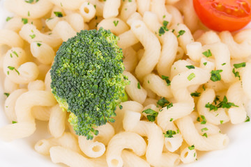 Pasta with broccoli and tomatoes.