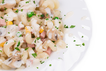 Pasta cavatappi with vegetables and sausage.