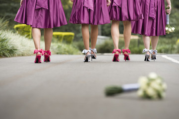 Group of ladies walking down road in colourful high heel shoes
