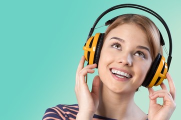 Music. Young woman listening to music