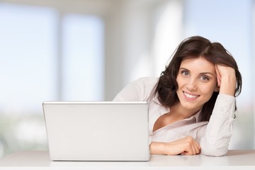 Laptop. Africian American Woman on White Seamless with laptop