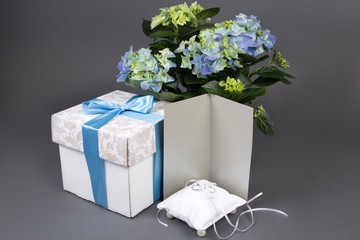 blank gift card, bouquet of hydrangea flowers, gift box and wedd