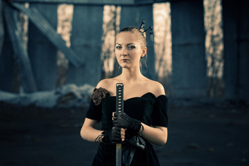 Fototapeta na wymiar young stylish woman portrait with sword