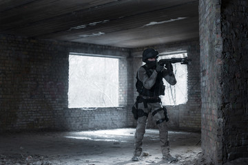 Airsoft strikeball player in military soilder uniform
