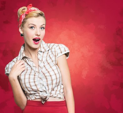 Retro. Pin-up style portrait of surprised blonde woman sepia