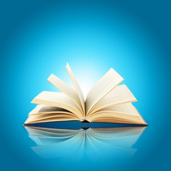 Opened book on bright blue background