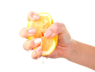 Female hand squeezing lemon isolated on white
