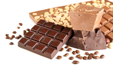 Chocolate bars with hazelnuts and coffee beans isolated on