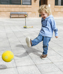 Little boy playing ball