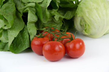 vegetables tomatoes lettuce dill isolated on white background