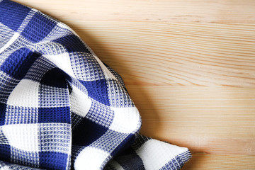 Kitchen towel on wooden background