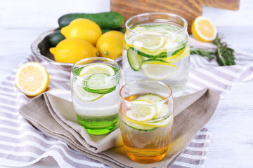 Fresh water with lemon and cucumber in glassware