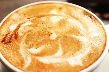Cup of coffee latte art, closeup