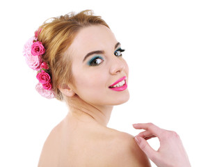 Naklejka premium Portrait of young woman with flowers in hair isolated on white