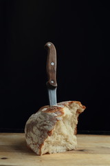 Piece of bread on the wooden board