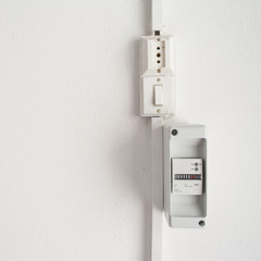 electricity meter in a white wall