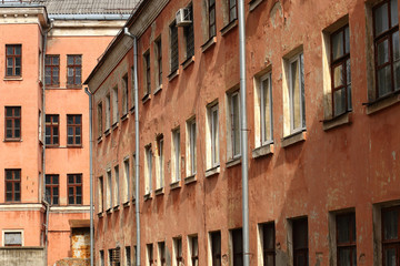 Fototapeta na wymiar Rows of windows on the facade wall