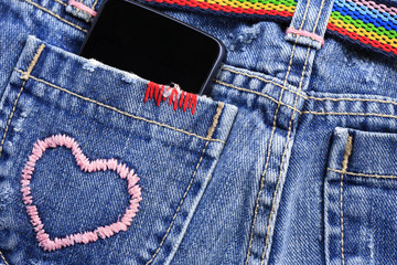 smart phone in the pocket of jeans