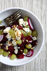 Homemade salad with beet, grapes