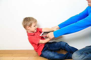 parent taking out touch pad from child