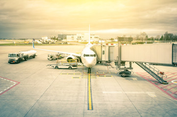 Modern airplane at tairport terminal gate ready for takeoff