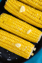 close view on Homemade golden corn cob with butter and salt