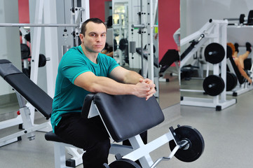 Fototapeta na wymiar Exercises for the biceps barbell