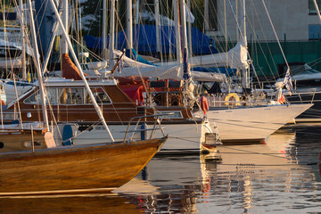 Yachts and pleasure boats parked with anchor in the harbor.
