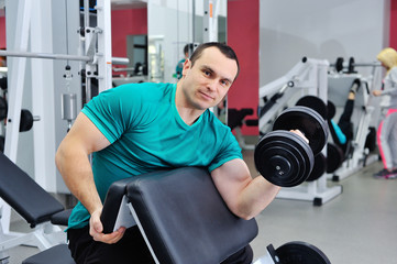 Naklejka na ściany i meble Exercises for the biceps with dumbbells