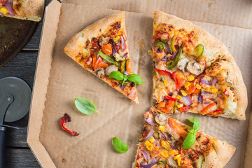 slices of homemade vegetarian pizza in box