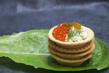 Tartlet with red caviar and cream cheese