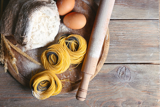 Still life of preparing pasta on rustic wooden background