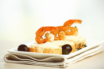 Appetizer canape with shrimp and olives