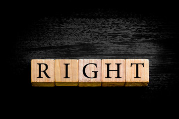 Word RIGHT isolated on black background with copy space