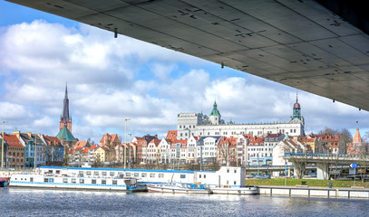 Panoramic view of Szczecin waterfront onder the bridge, Poland. - obrazy, fototapety, plakaty