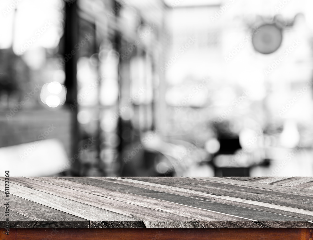 Aufkleber Empty wood table top with coffee shop blur with bokeh background