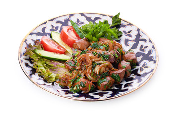 Fried meat with onion in a frying pan