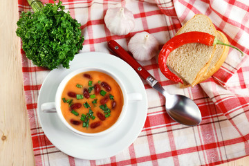 Bean soup in bowl with fresh sliced bread