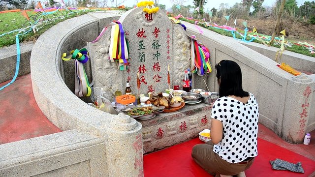 Thai woman praying graveyard of Ancestor Worshipping