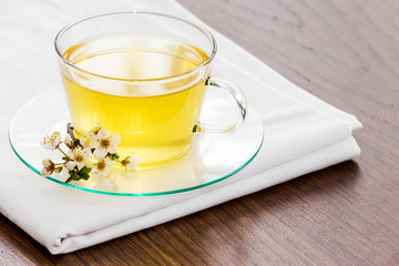 Glass tea cup cherry blossoms.