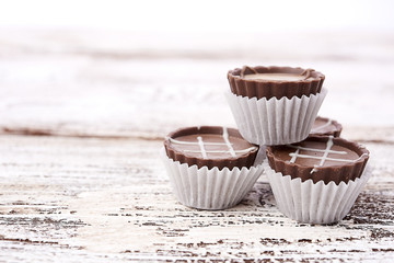 Dark chocolate on wooden background